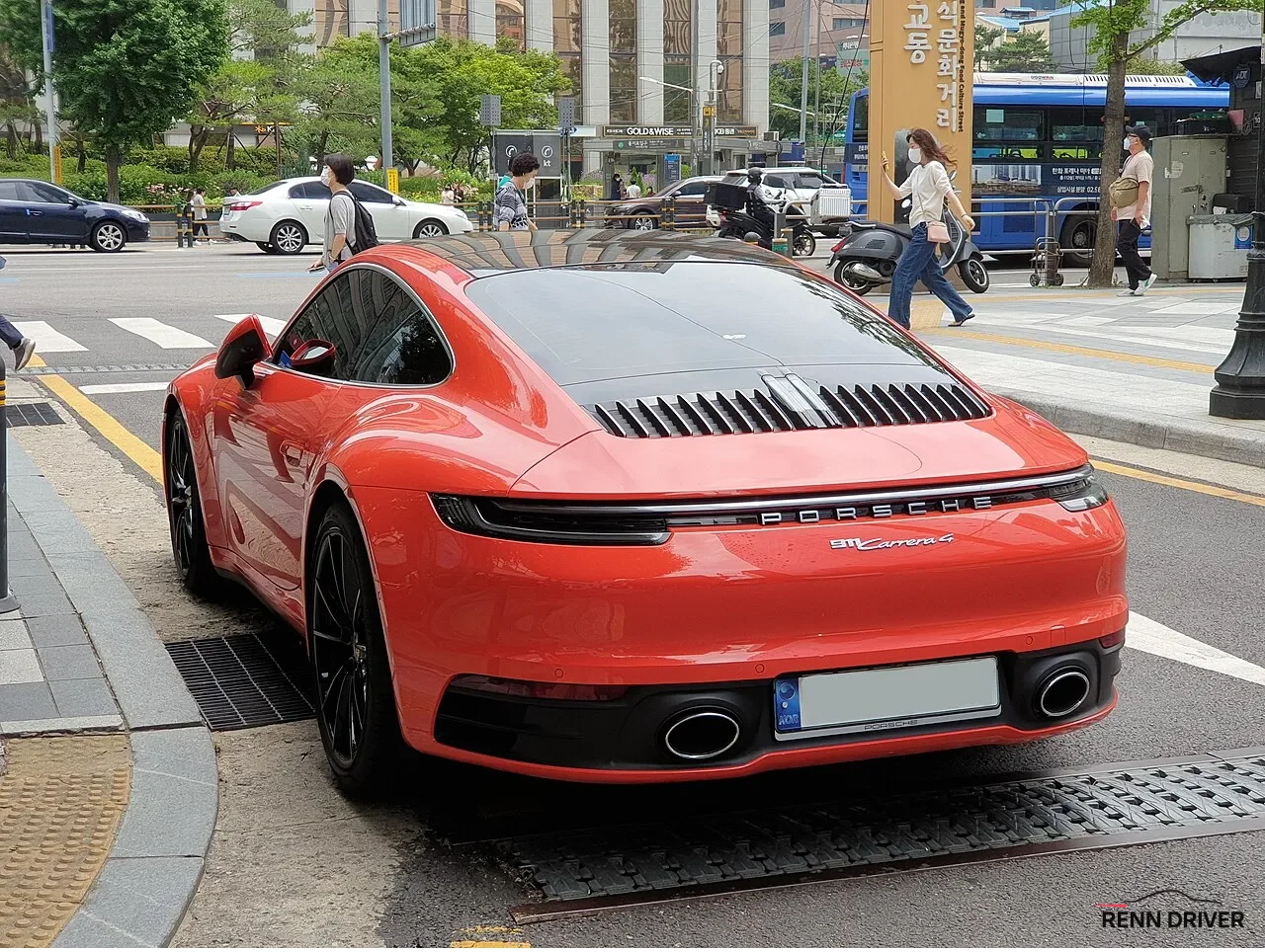 Red Porsche 992 Carrera 4 rear view