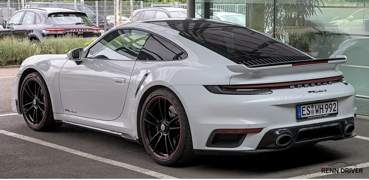 White Porsche 992 Turbo S rear three-quarter view