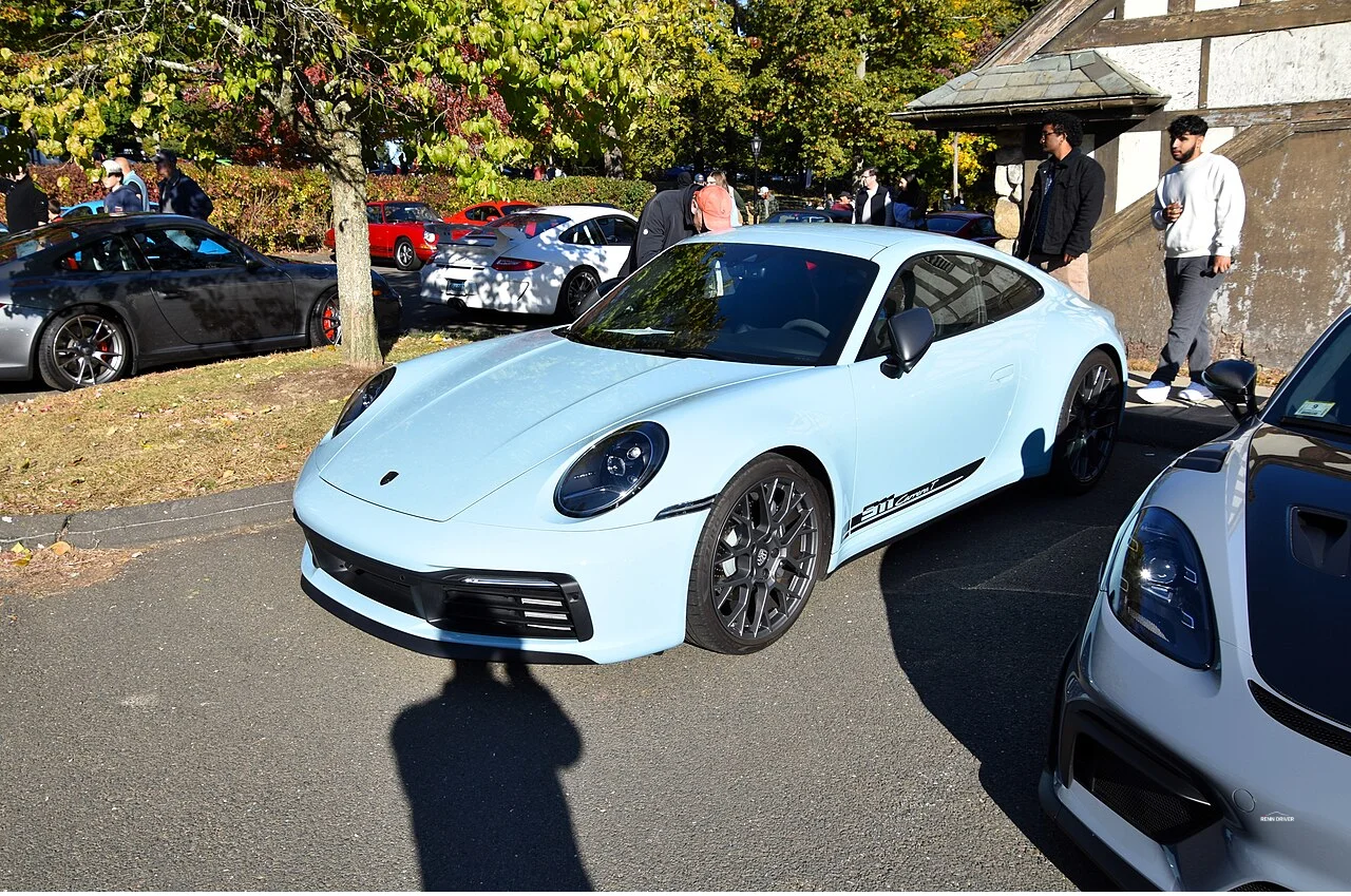 Ice Blue Metallic Porsche 992 Carrera T front three-quarter view