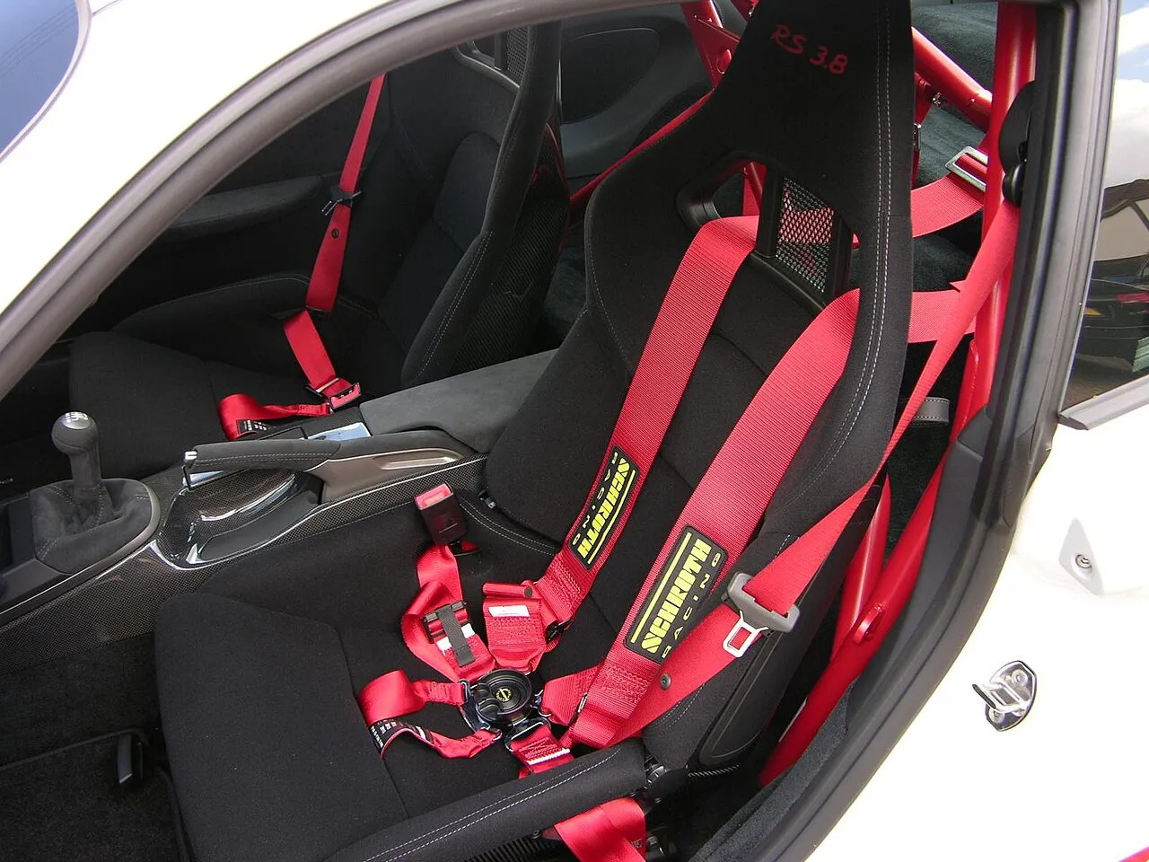 Full bucket seat with six-point harness in a Porsche 997 GT3 RS