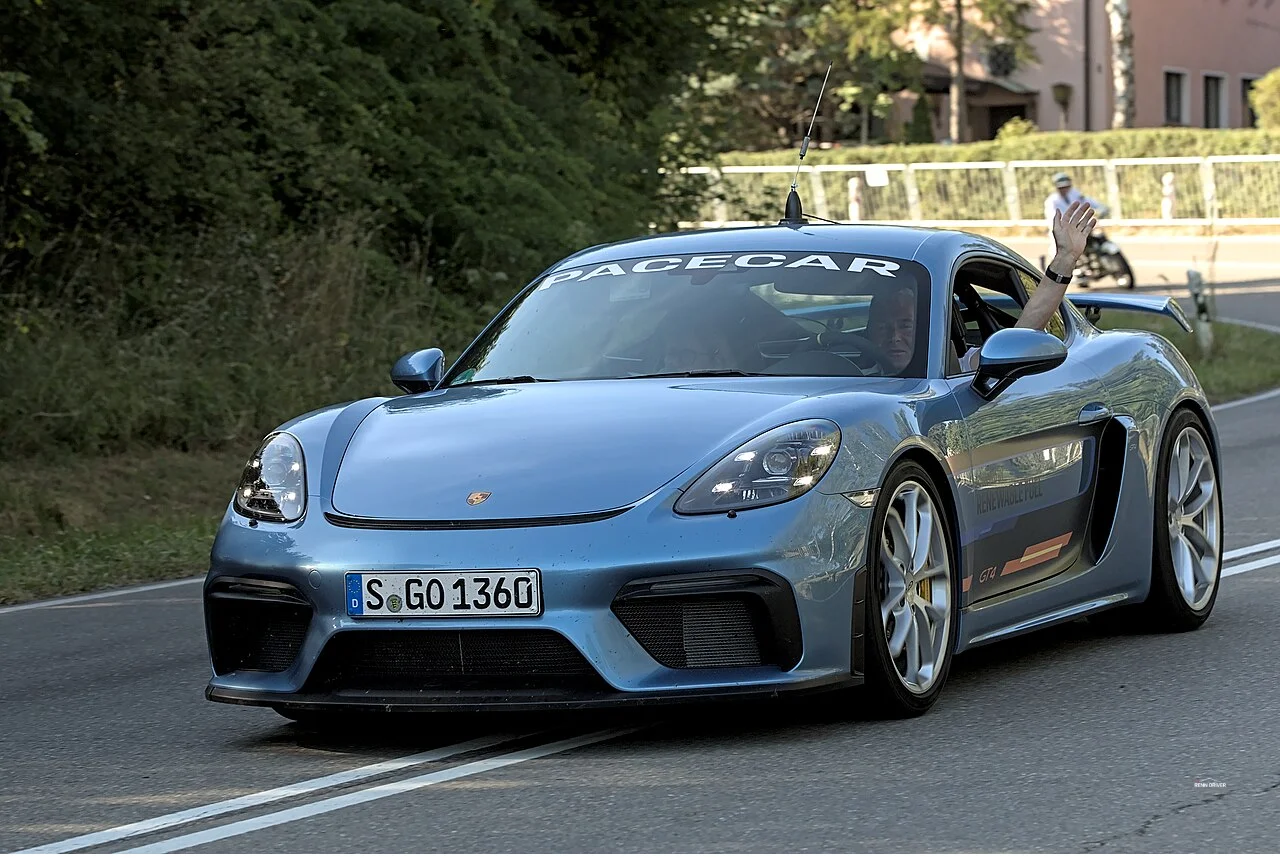 Yellow Porsche 718 Cayman GT4 on track at Solitude Revival
