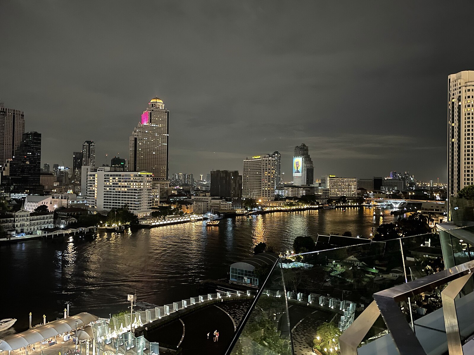 Chao Phraya River at night with Bangkok skyline