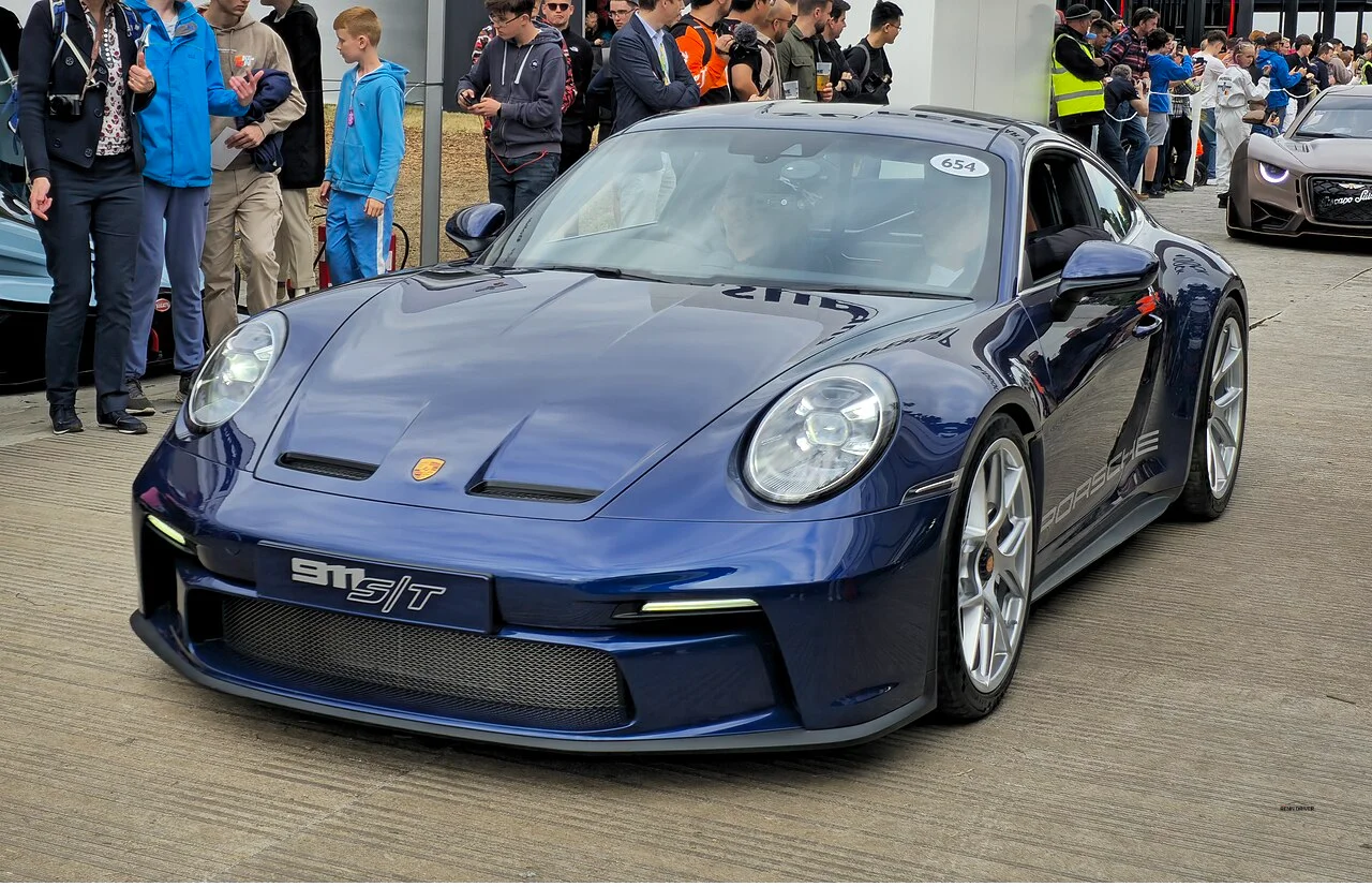 Porsche 911 S/T in dark blue at a car show