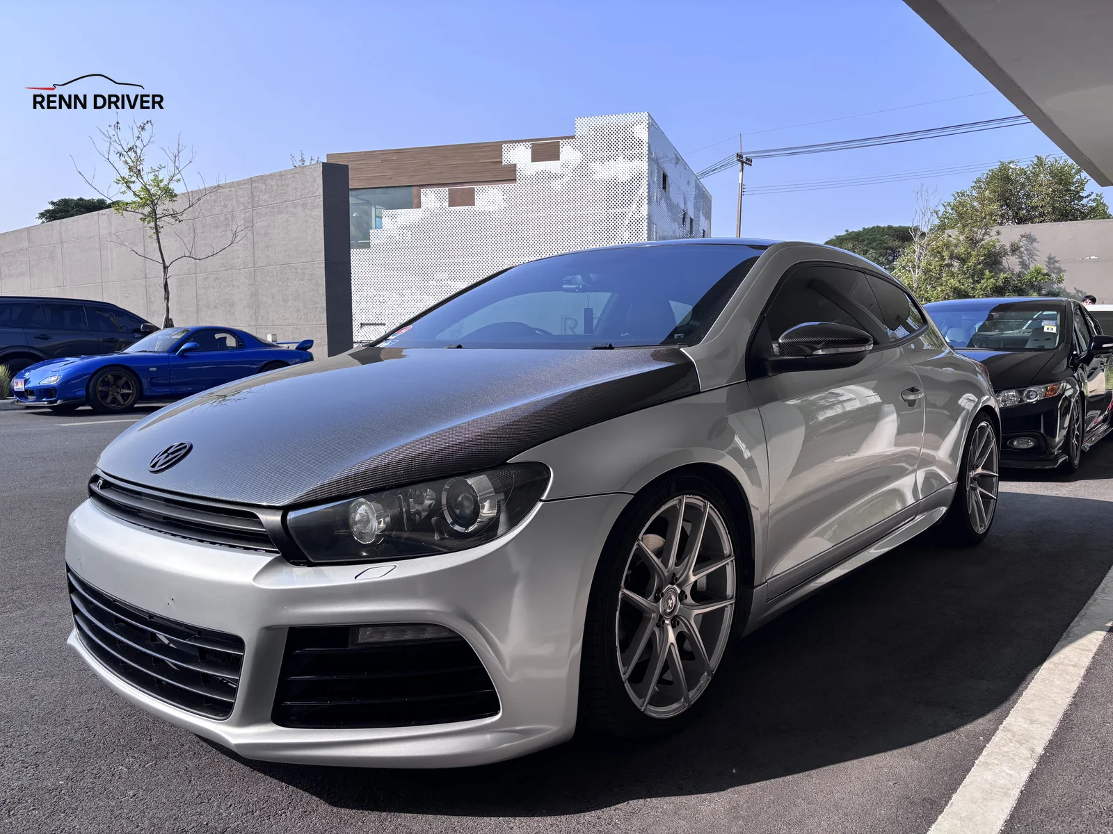 Silver Volkswagen Scirocco R with carbon fiber hood