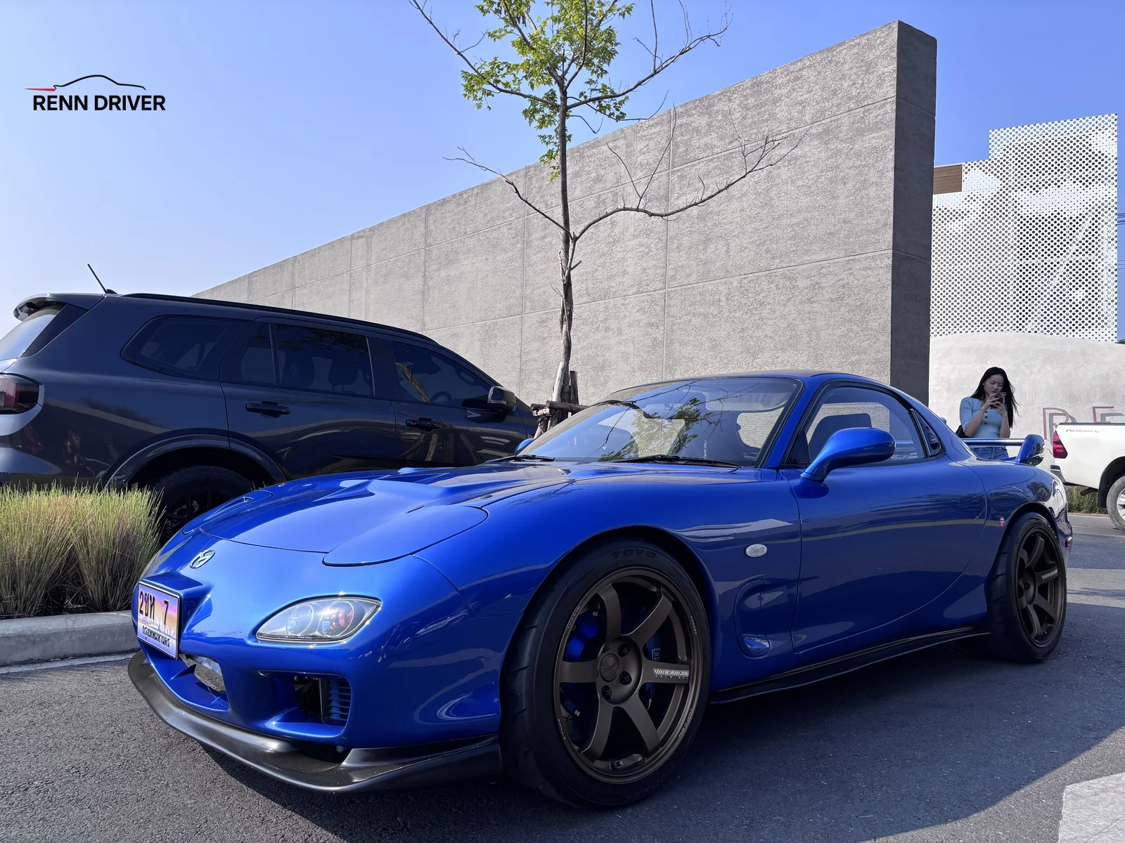 Blue Mazda RX-7 FD with black wheels