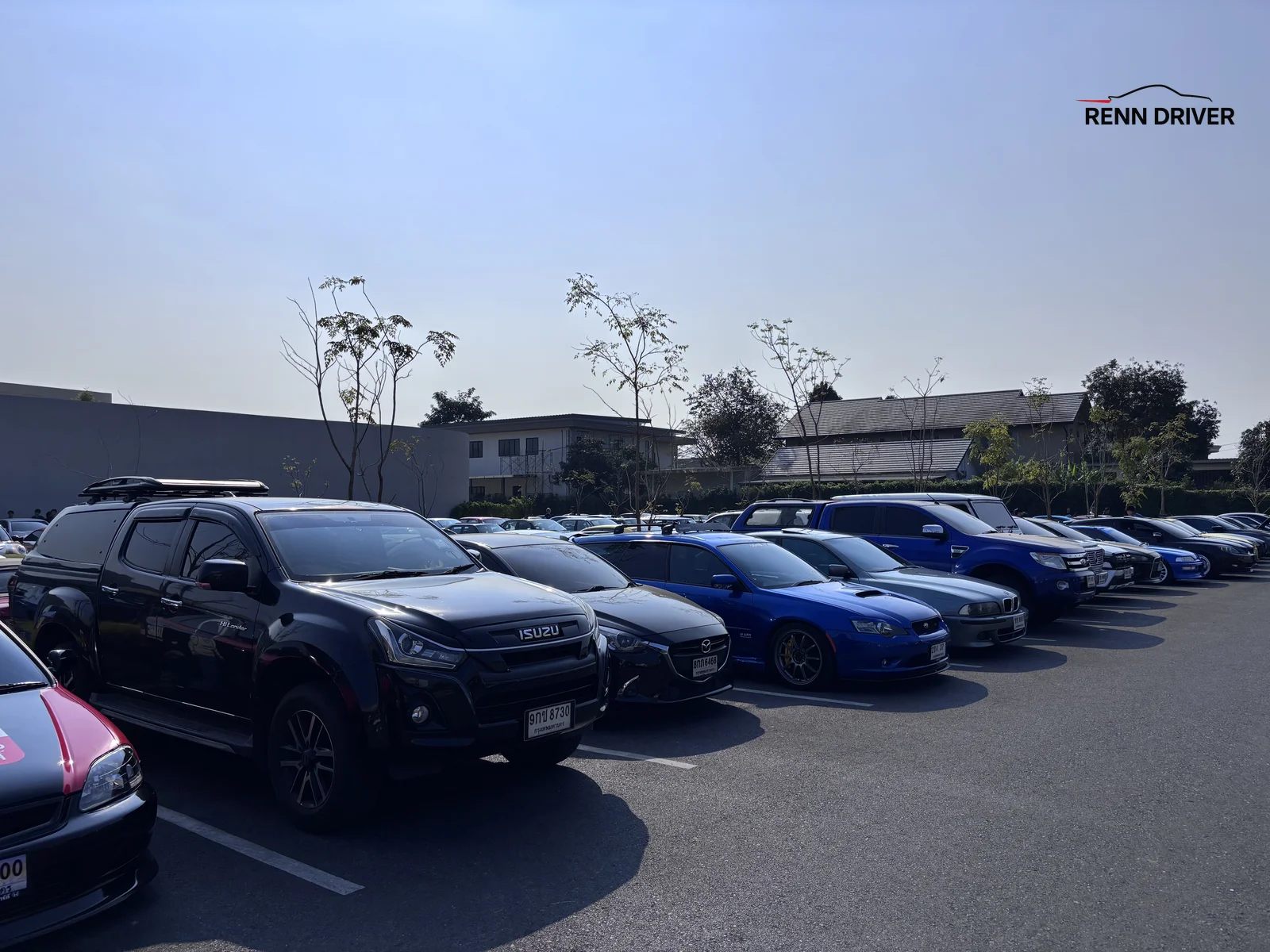 Wide shot of the Rising Sunday car meet parking lot in Bangkok