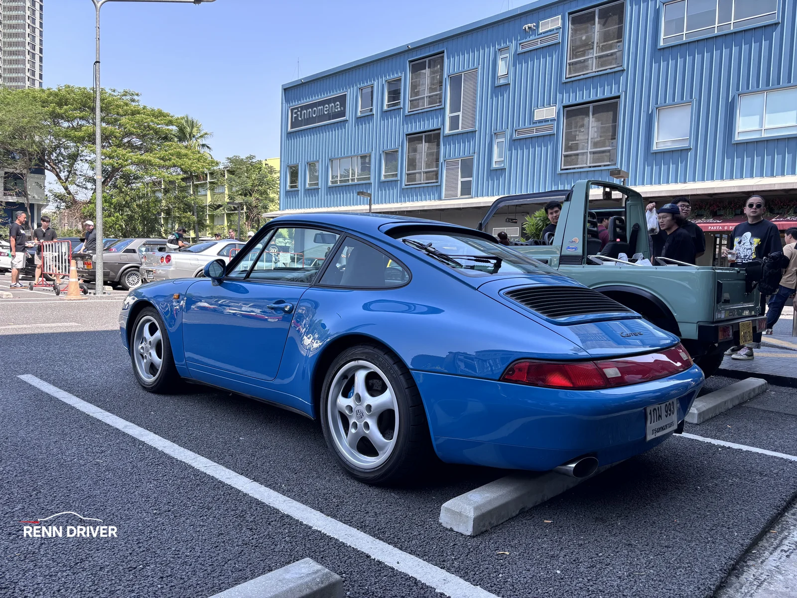 Blue Porsche 993 rear three-quarter view