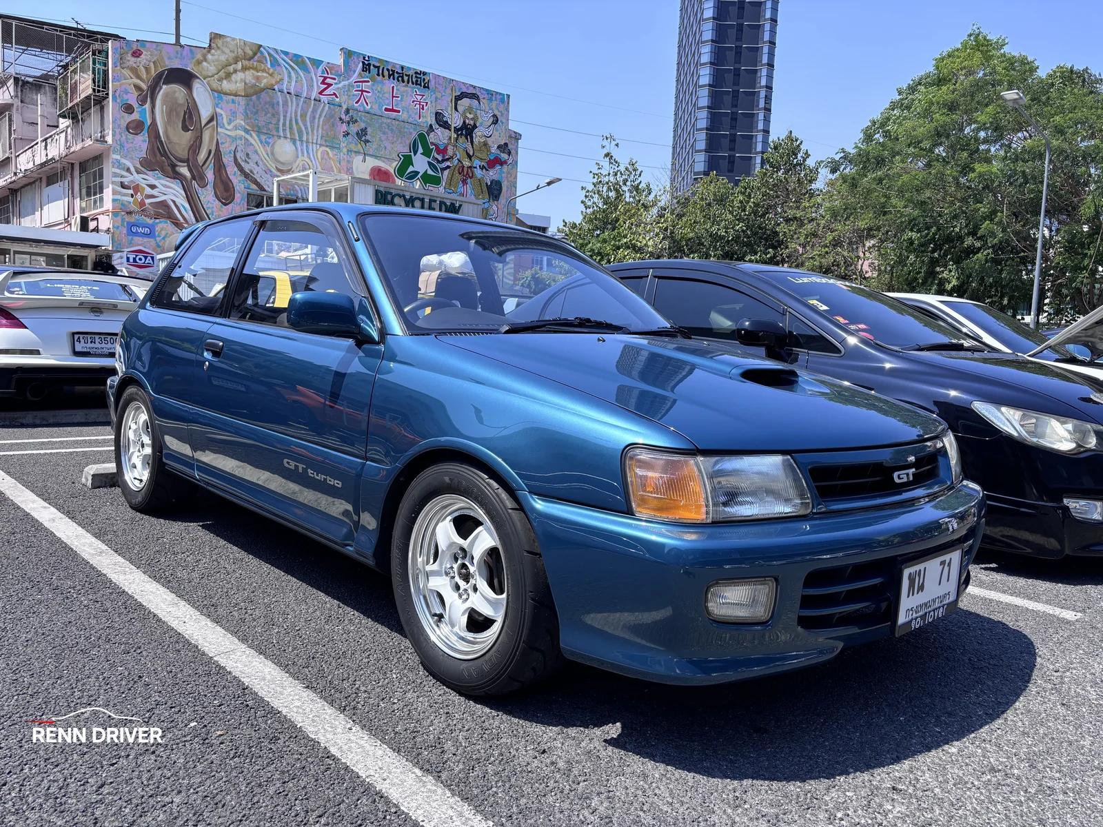 Teal Toyota Starlet GT front view