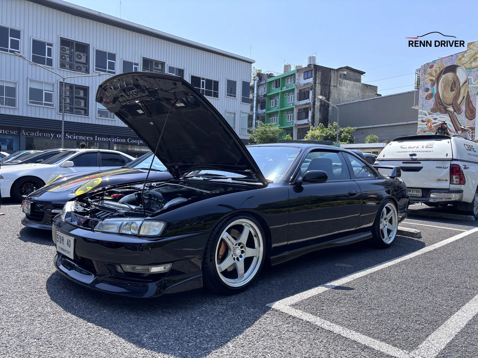 Black Nissan Silvia S14 with hood open