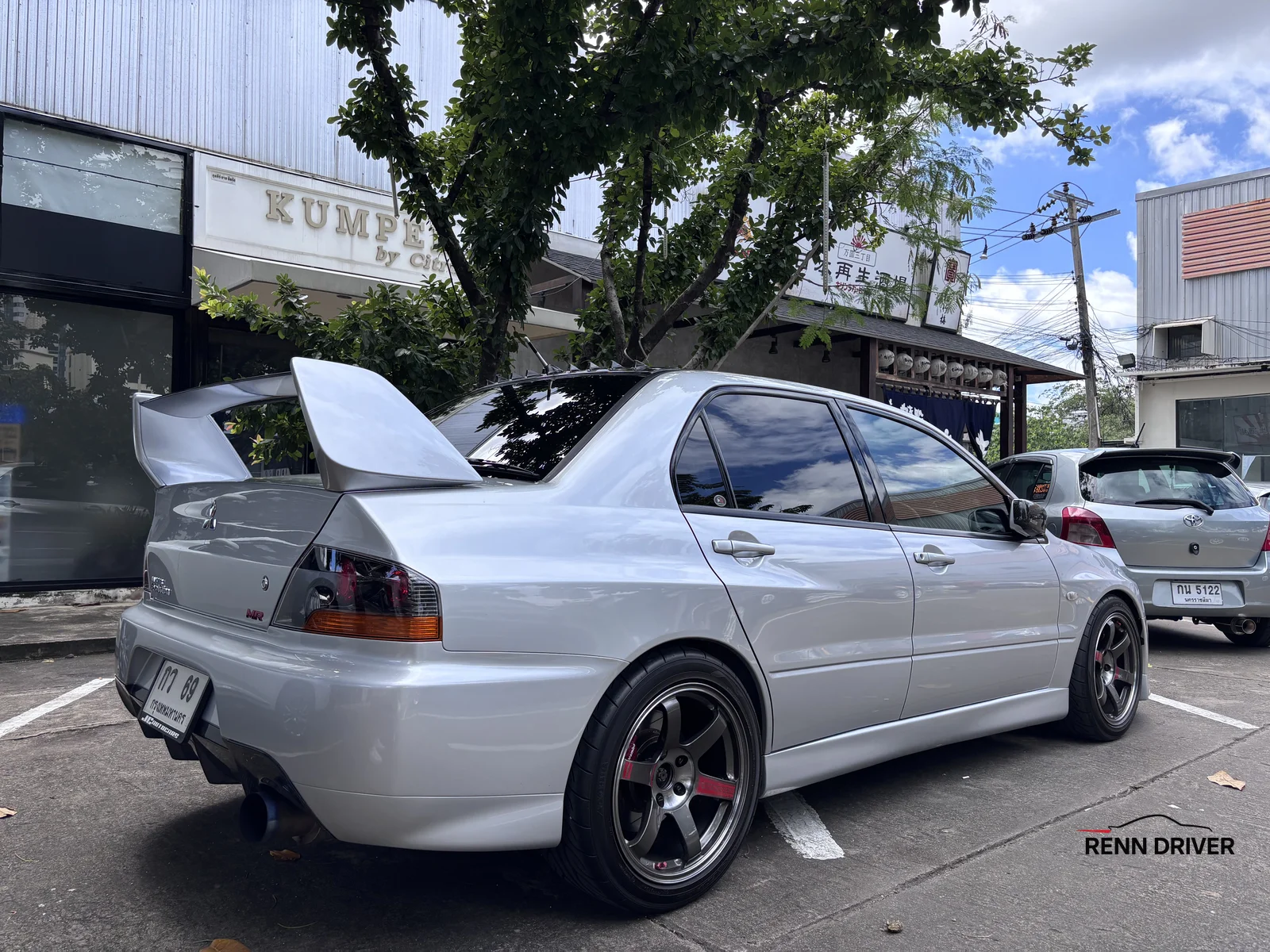 Silver Mitsubishi Lancer Evolution with big wing