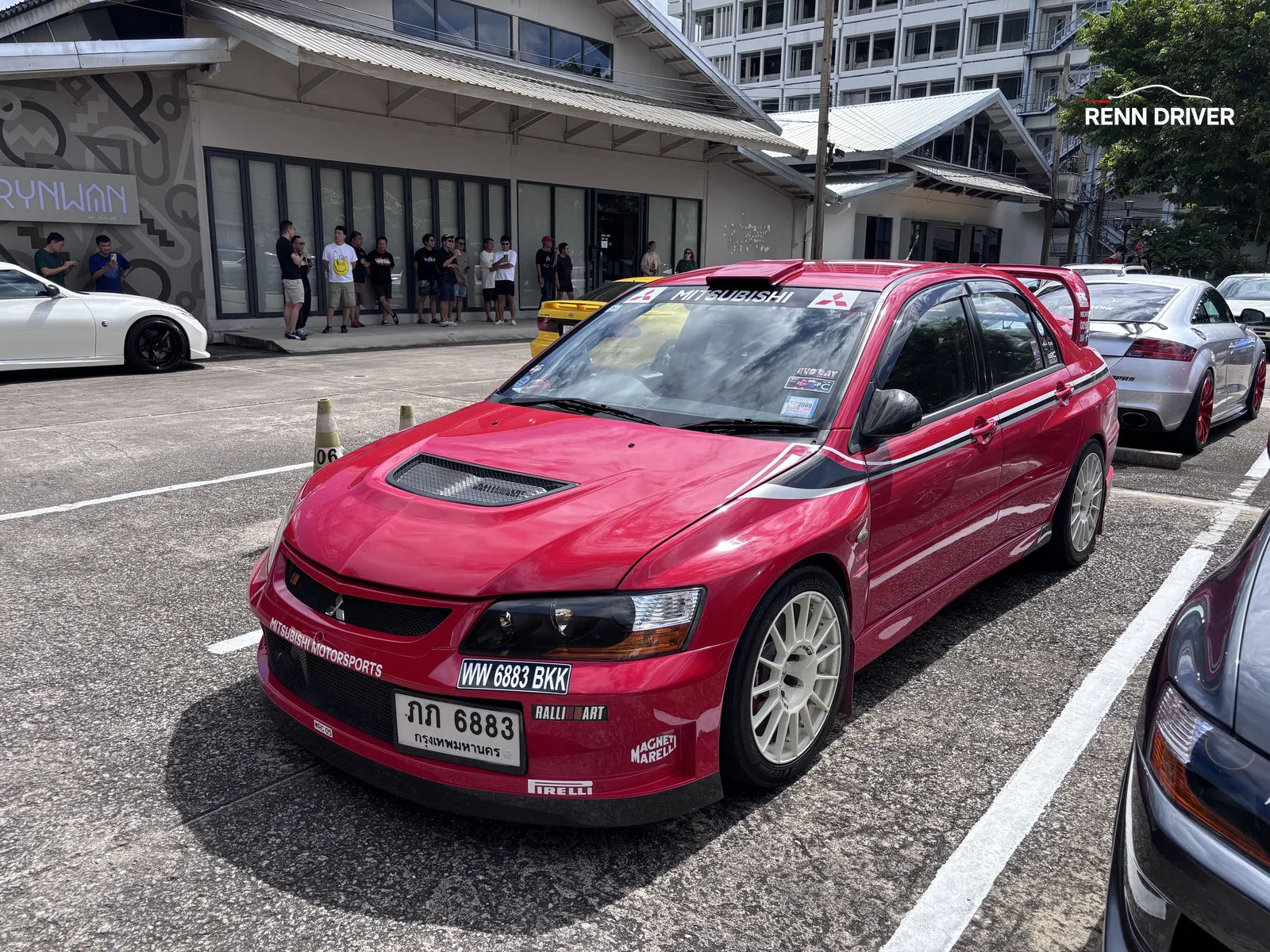 Red Mitsubishi Lancer Evolution IX rally car