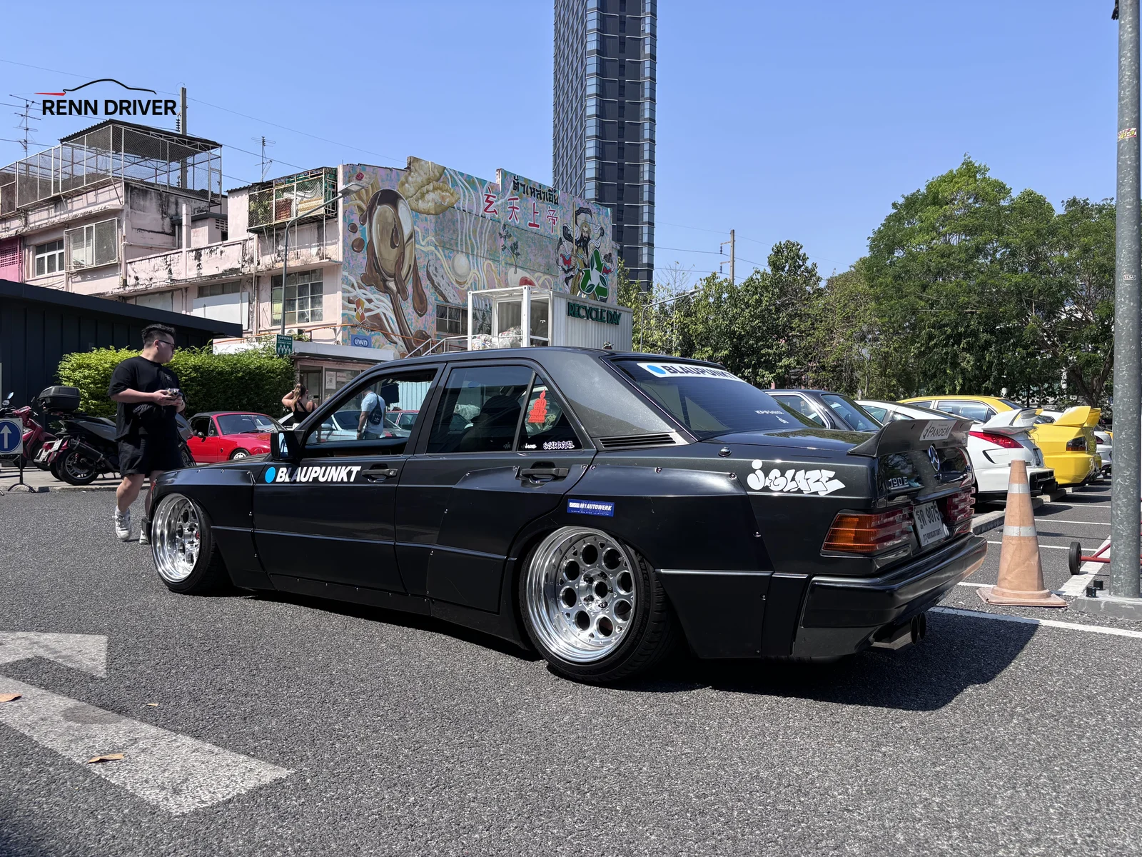 Slammed black Mercedes 190E with Blaupunkt livery
