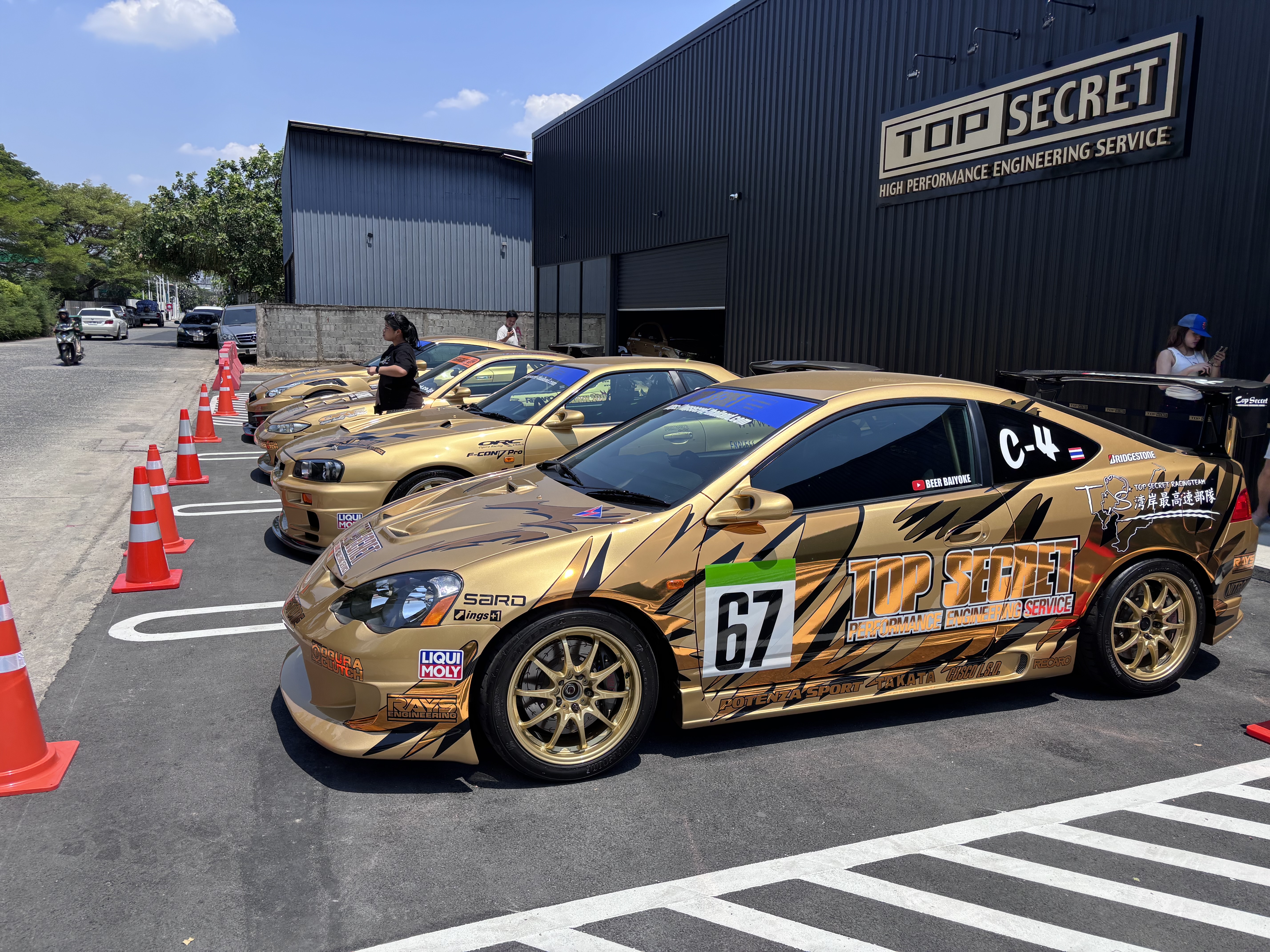 Gold DC5 Integra with Top Secret livery number 67