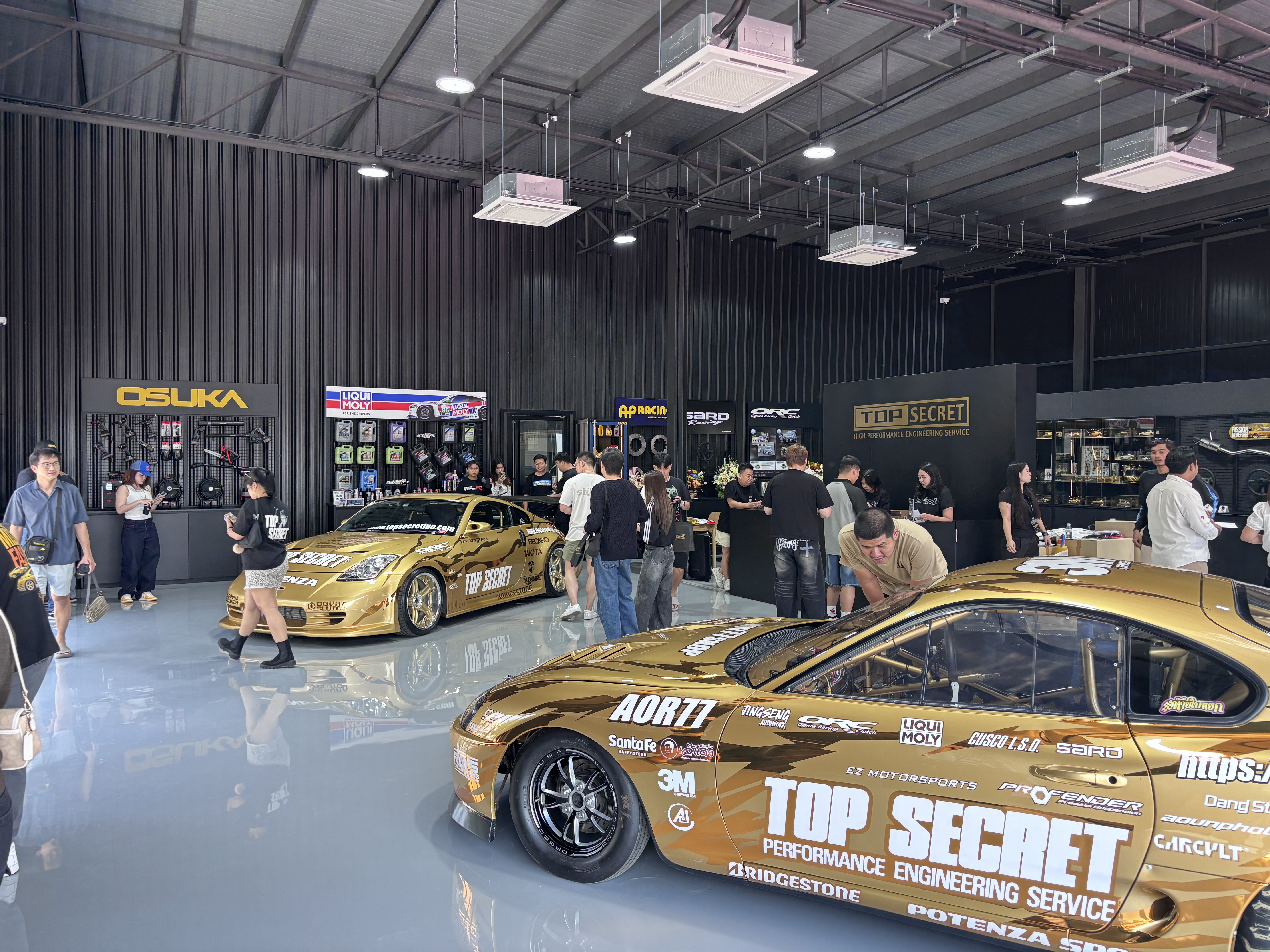 Top Secret Cafe showroom with gold 350Z and S15 Silvia on display