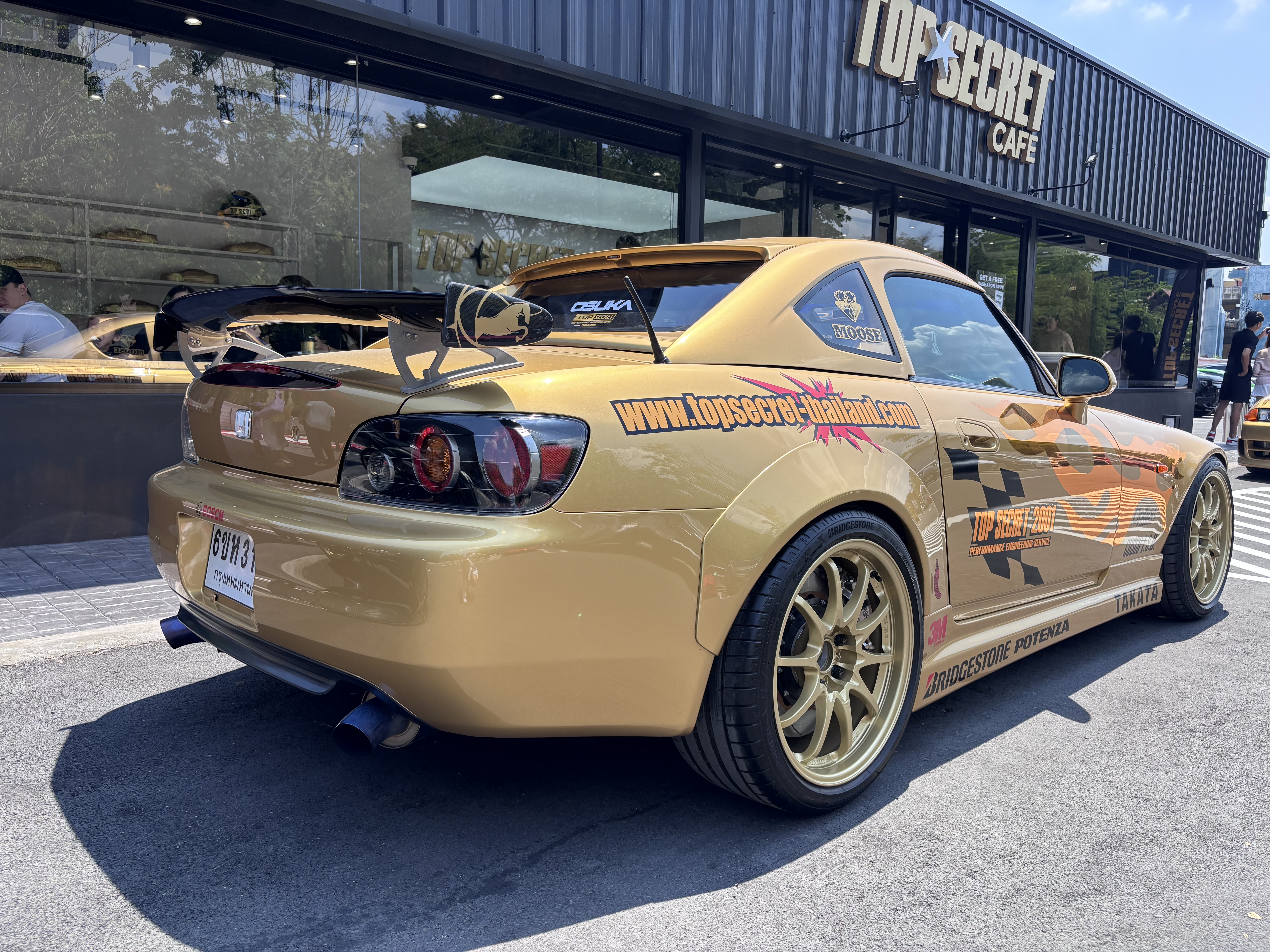 Gold Top Secret S2000 rear view outside Top Secret Cafe